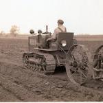 Frank Held's son operating their Cletrac tractor on their 106 acre farm in South Bloomfield, Ohio. After the Frank Held Tractor Company was sold, he became a Cletrac distributor. 